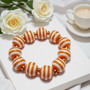 Striped Orange and White Beaded Stretch Bracelet with Gold Accents